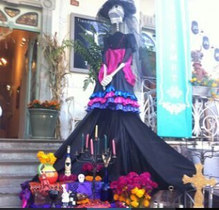A Catrina figure on a Day of the Dead ofrenda altar.